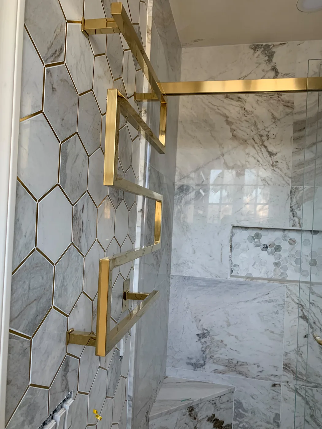 Finished bank of light switches on a decorative tiled wall